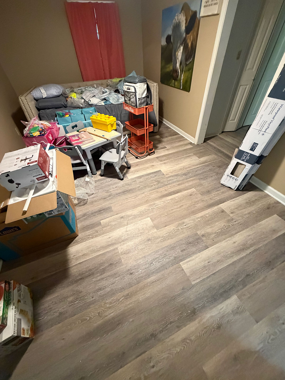 Bedroom with newly installed luxury vinyl plank flooring