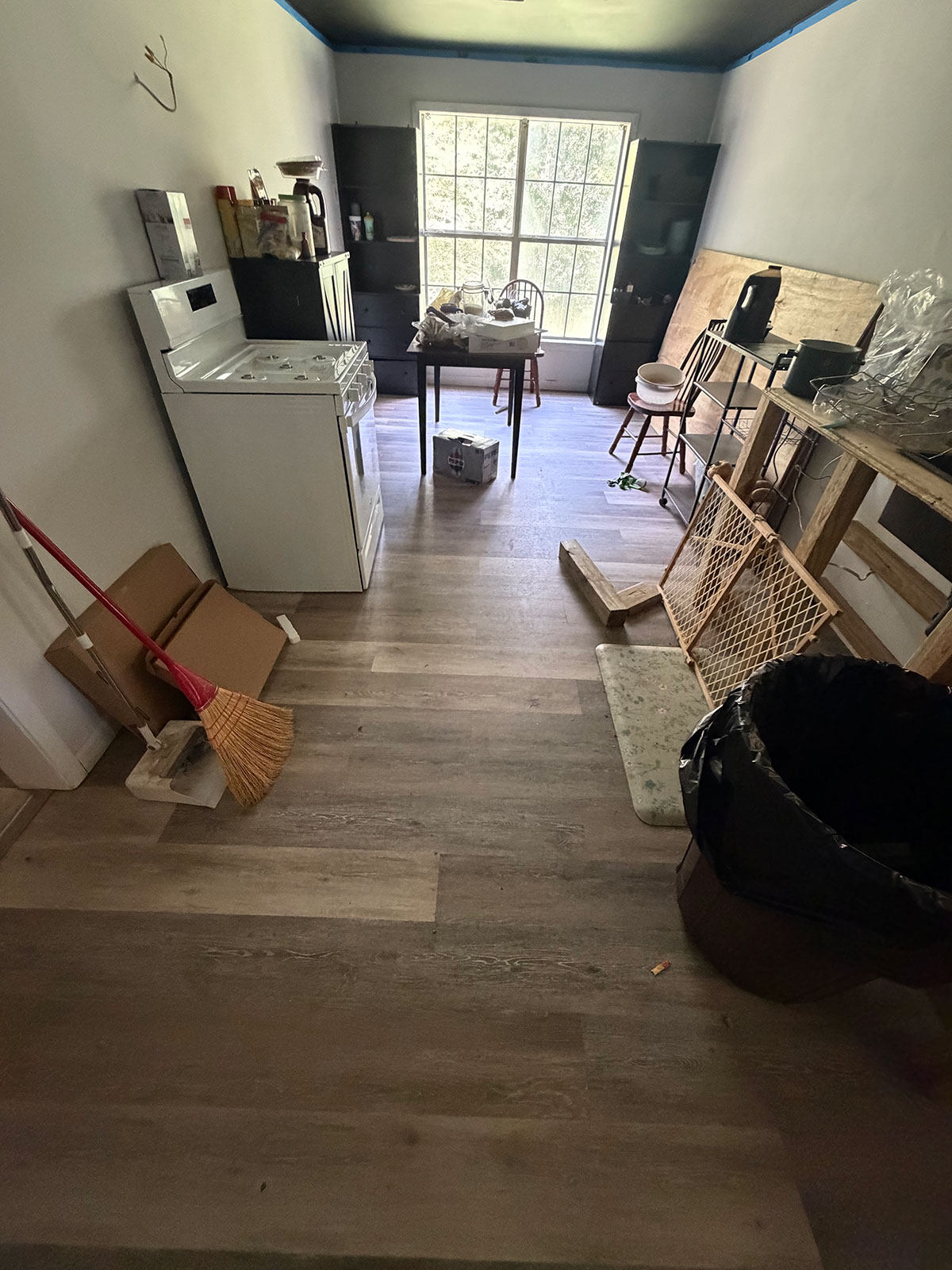 Kitchen and dining area mid-renovation with new floors