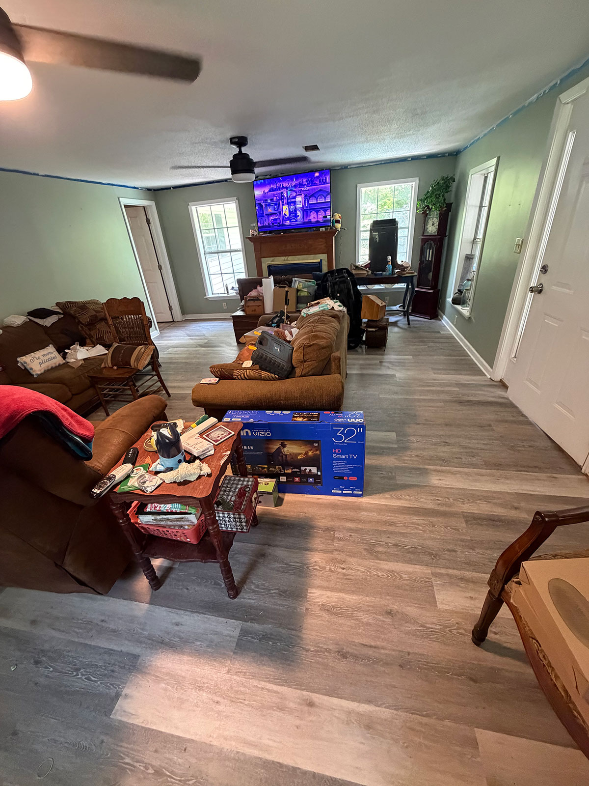 Large living room remodel with new flooring throughout